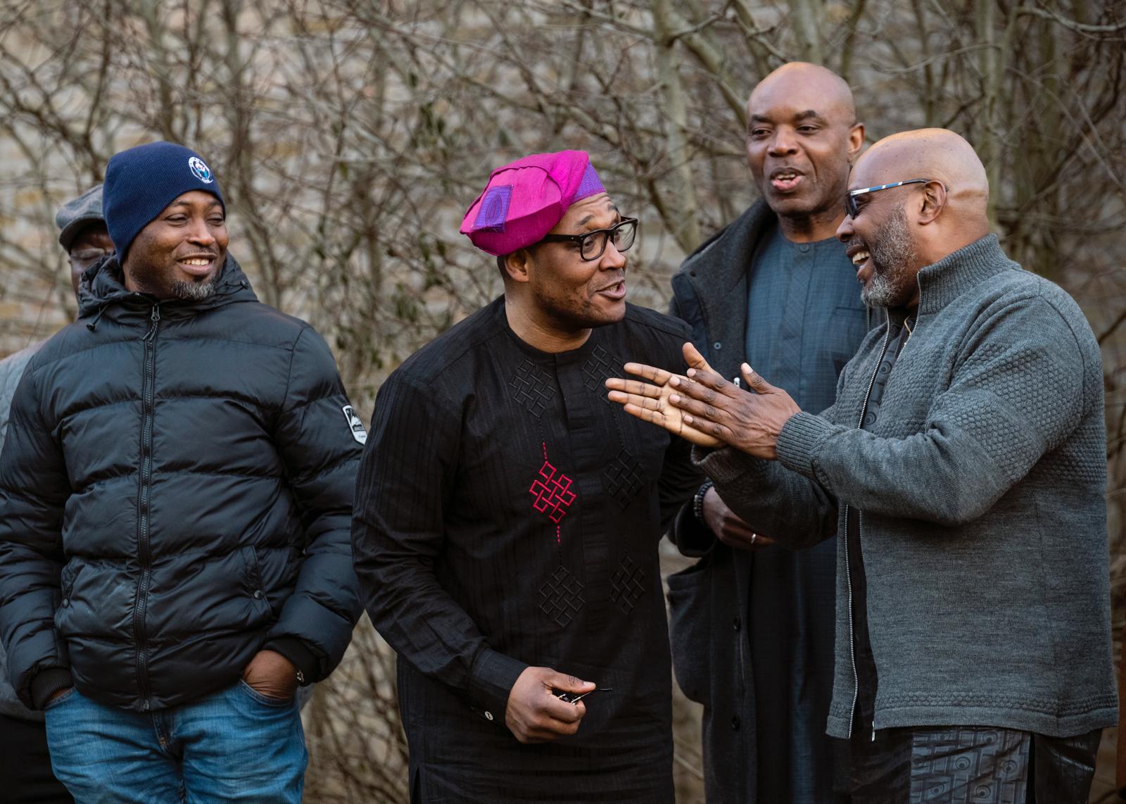 Diaspora members in conversation outdoors